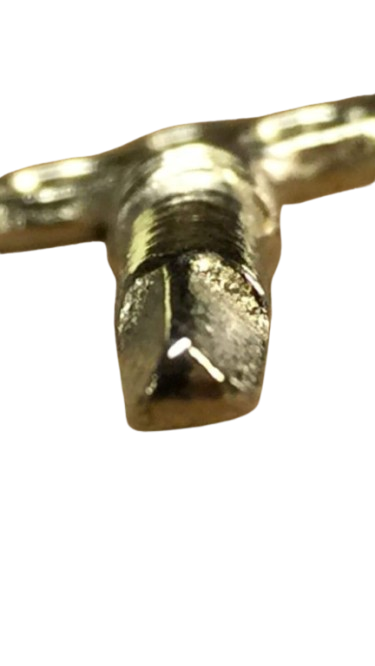 Close-up of silver triangle piano key end.  {In Tune Piano Supply | Everett Piano Services}